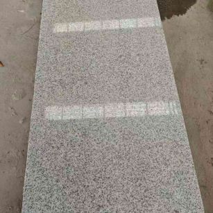 辽宁芝麻白光面毛板